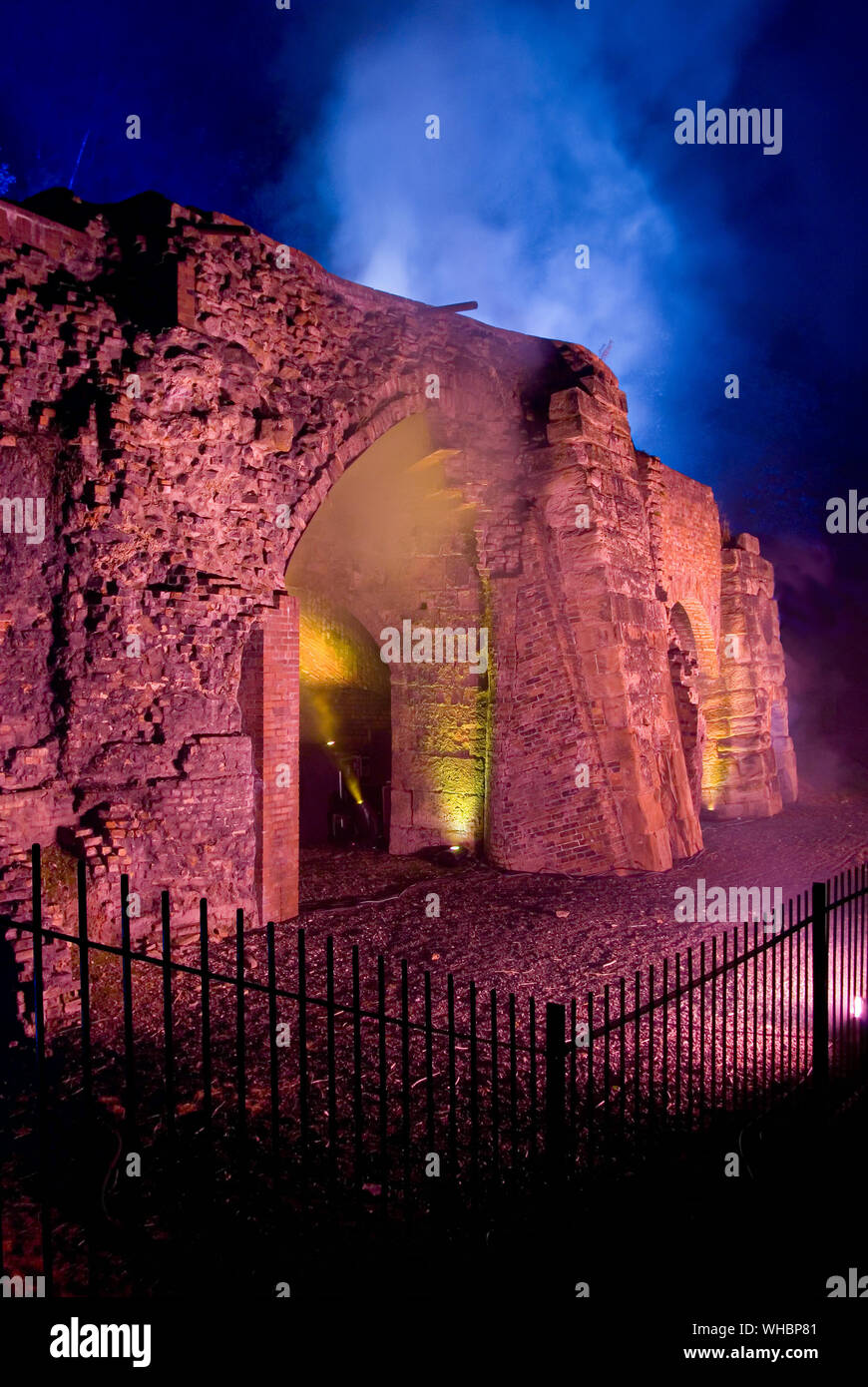 Bedlam Furnaces, Ironbridge Gorge with fake smoke illuminated as part of a celebration (Portrait) Stock Photo