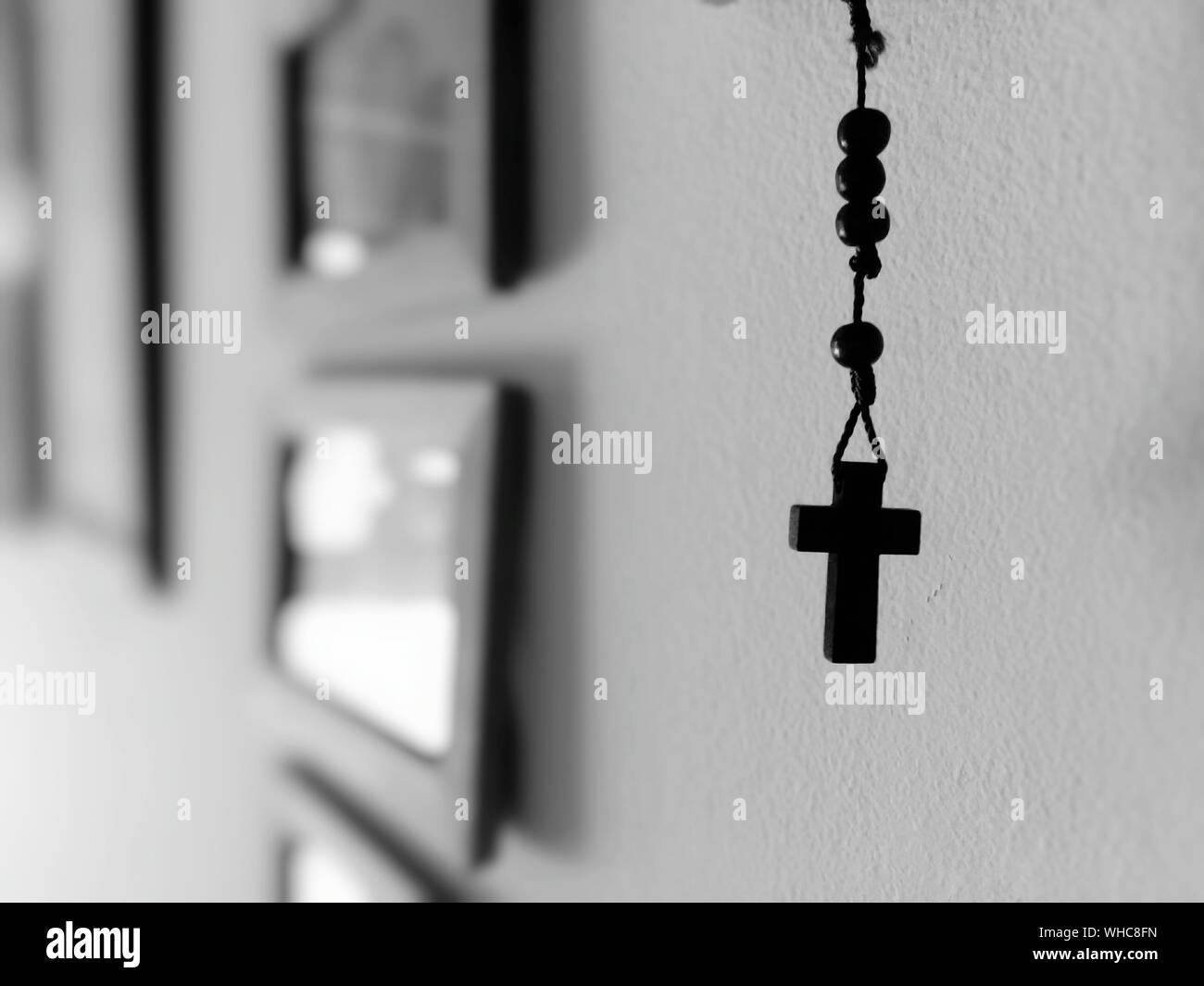 Rosary Hanging By Wall At Home Stock Photo - Alamy