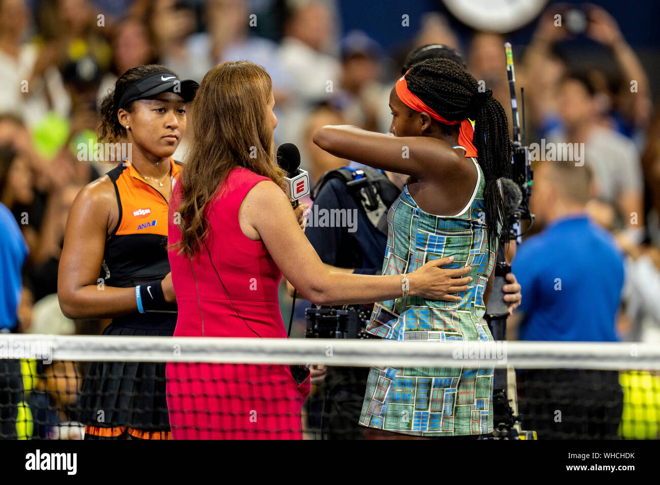 ESPN s Mary Jo Fernandez interviews Coco Gauff of the United States and Naomi Osaka of Japan who defeated her in Arthur Ashe Stadium in the third rou Stock Photo