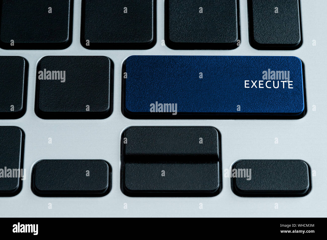 Execute on laptop Keyboard. Theme of business technology and digital enterprise. Stock Photo
