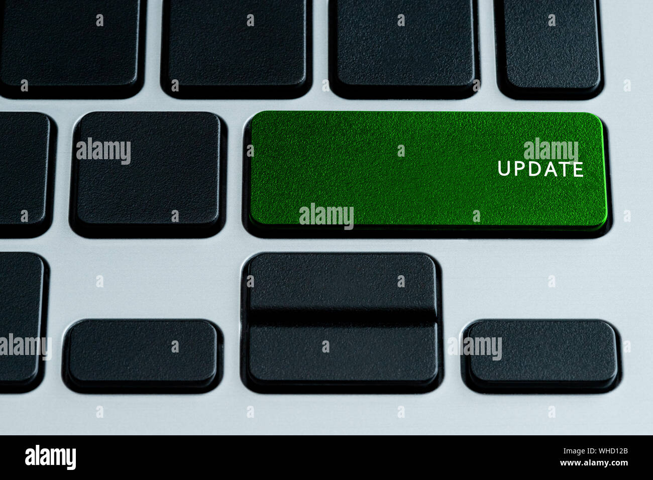 Update on laptop keyboard.  Isolated text on theme of internet security. Stock Photo