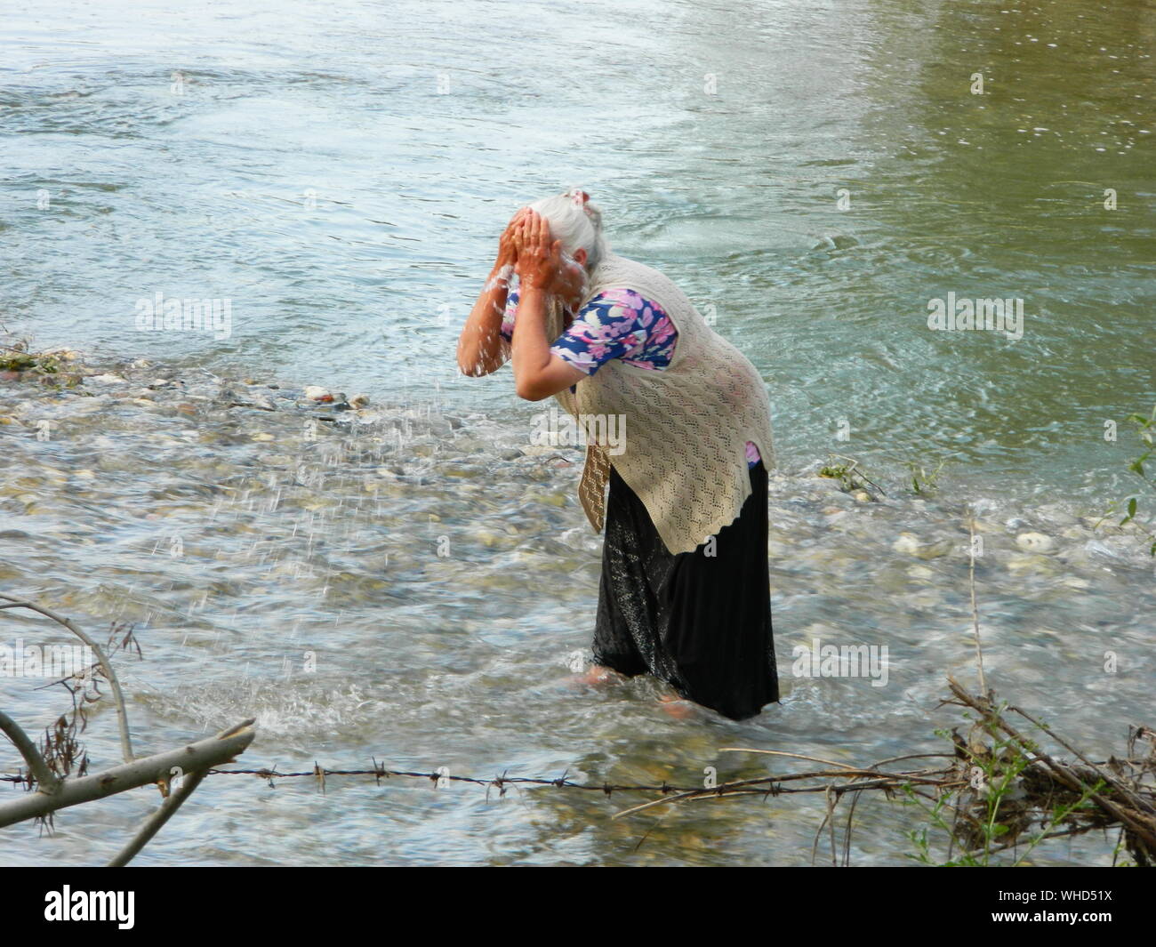 Face washing in river water hi-res stock photography and images - Alamy