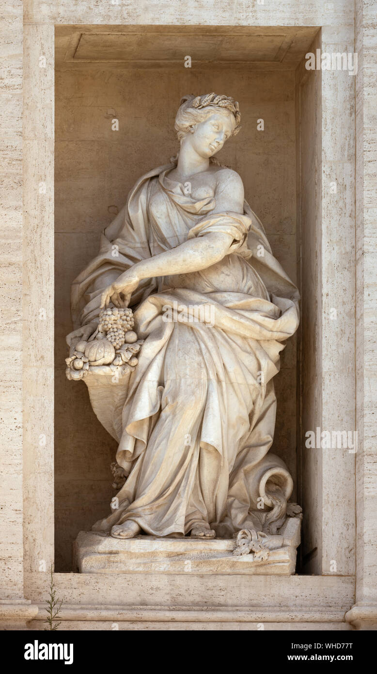 Statue of Abundance of Fruits with a horn of plenty. Detail of the Trevi fountain, Rome, Italy Stock Photo