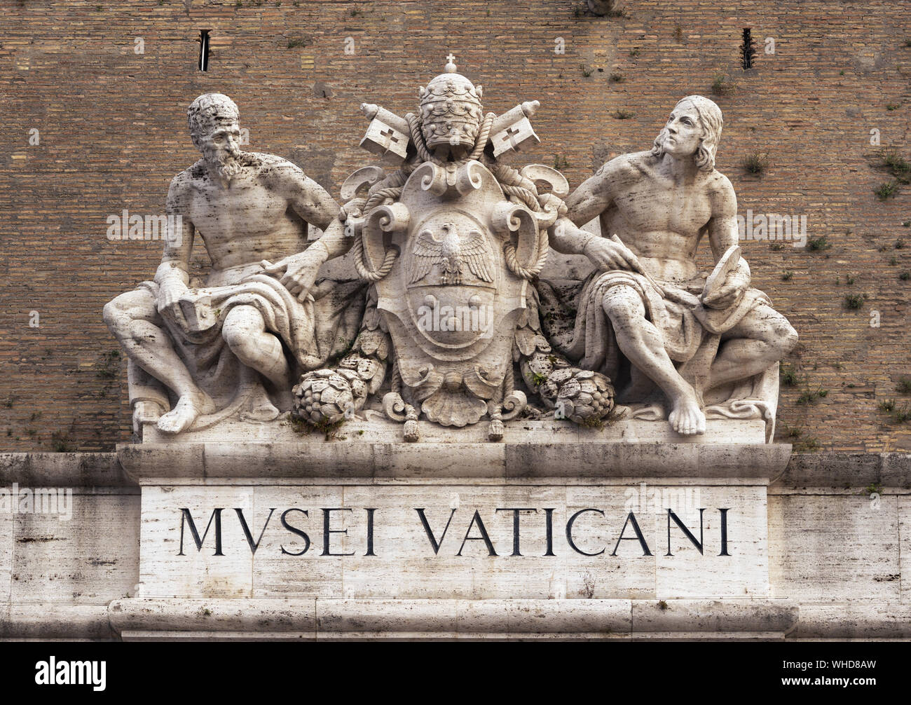 Statues of Michelangelo and Raphael over the Vatican museums