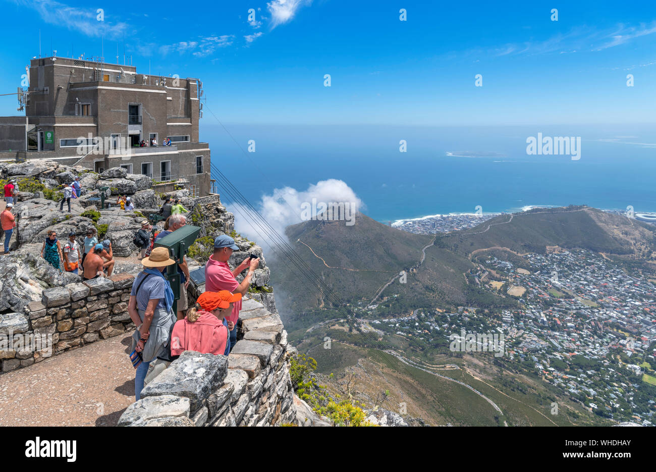 View from Table Mountain with the Table Mountain Aerial Cableway in the foreground and Lion's Head and Signal Hill behind, Cape Town, South Africa Stock Photo