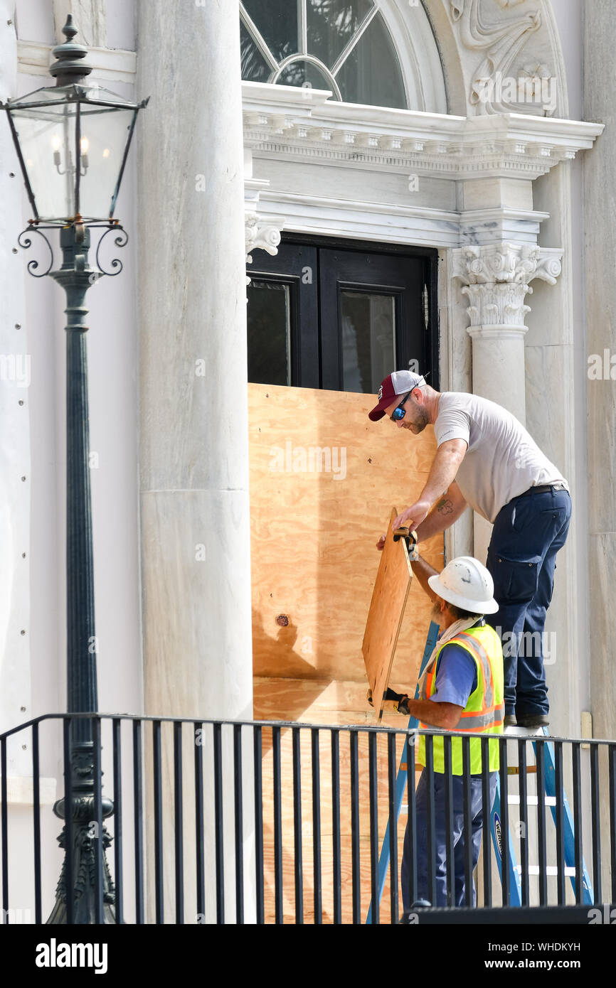 Charleston, South Carolina, USA. 02nd Sep, 2019. Workers attach board up the historic Charleston City Hall in preparation for Hurricane Dorian on Monday, September 2, 2019 in Charleston, South Carolina. The monster Category 5 storm devastated the Bahamas and is expected to weaken and then move north along the Eastern Seaboard.  Photo by Richard Ellis/UPI Credit: UPI/Alamy Live News Stock Photo