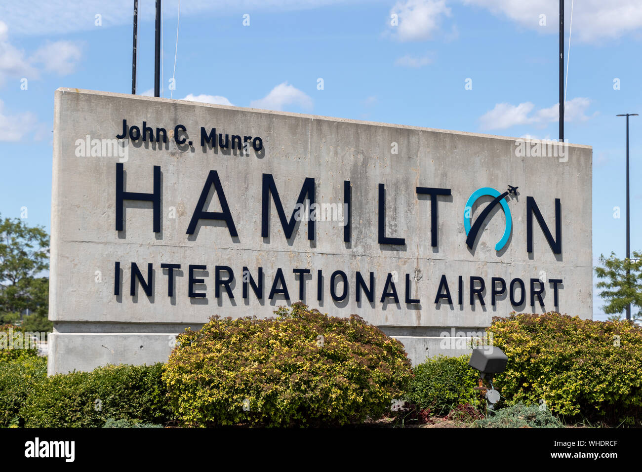 'John C. Munro Hamilton International Airport' sign at the entrance to the airport terminal. Stock Photo