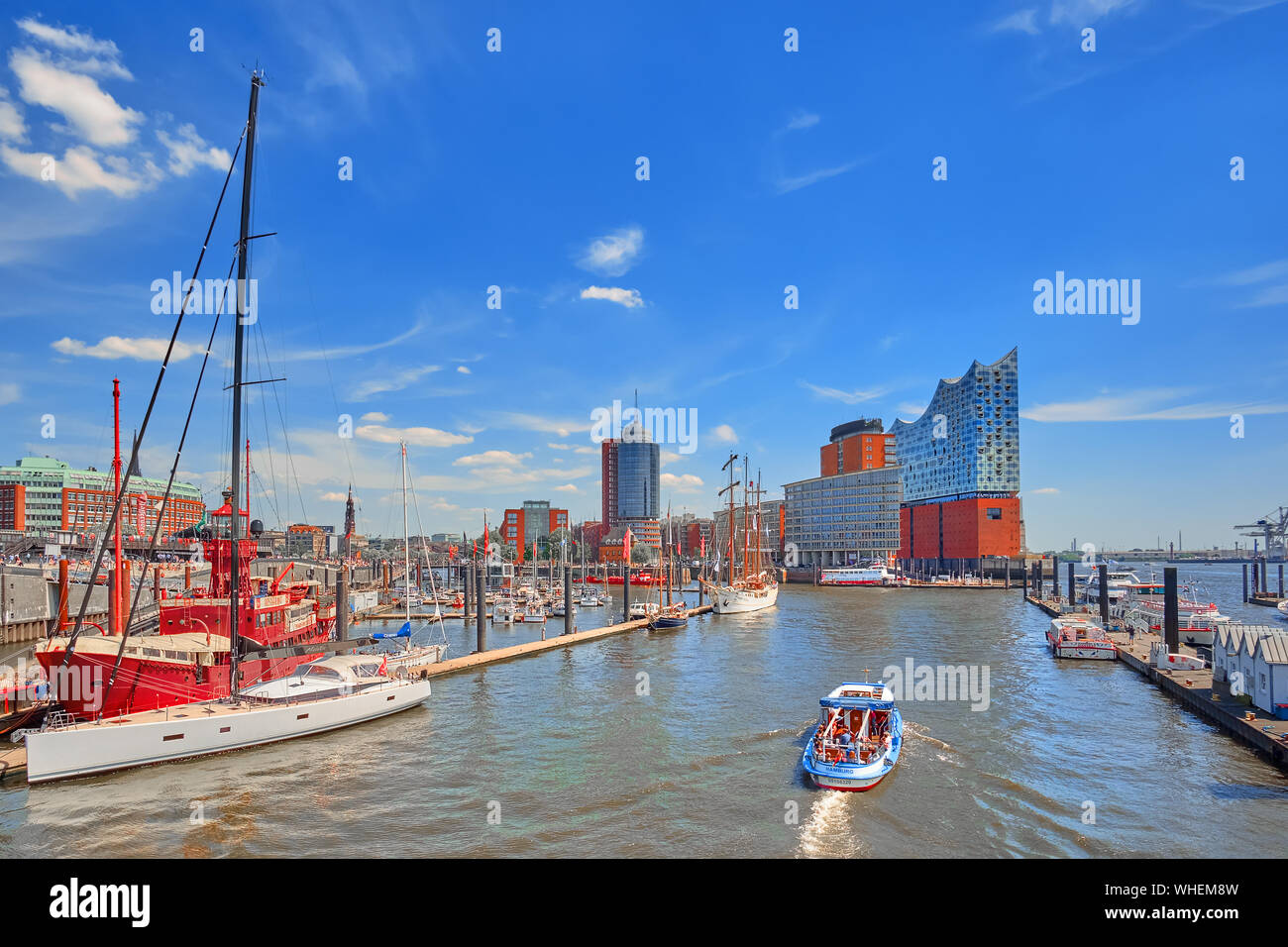 Hamburg, Germany - May 22, 2018: Beautiful view to the harbor yachts and city tour boats in Hamburg sea port on a sunny day in summer. Stock Photo