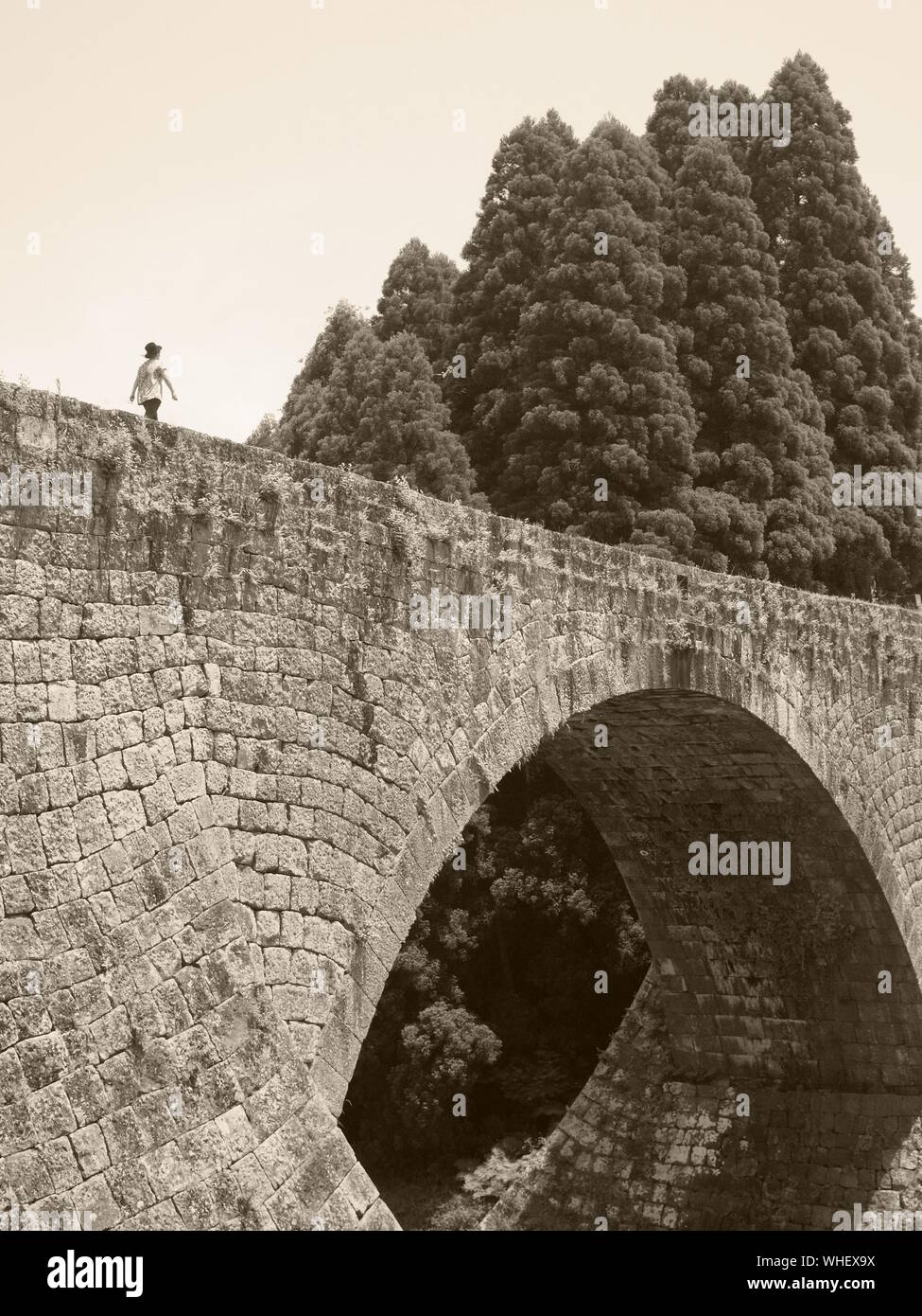 Man walking on a bridge hi-res stock photography and images - Alamy