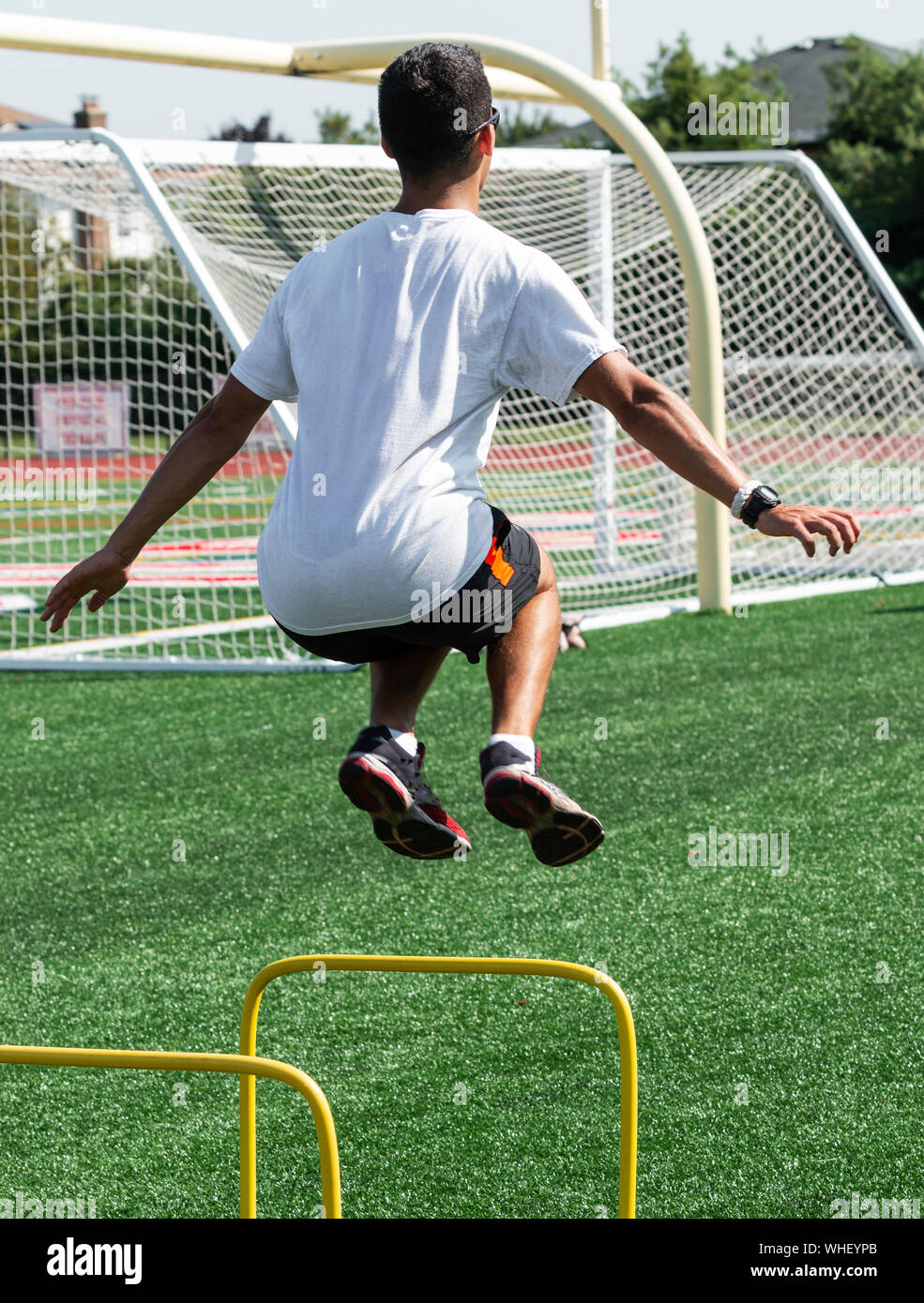 Athlete jumping over hurdle hires stock photography and images Alamy