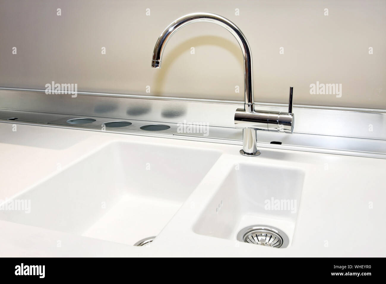 White Sink And Stainless Still Faucet In Kitchen Stock Photo