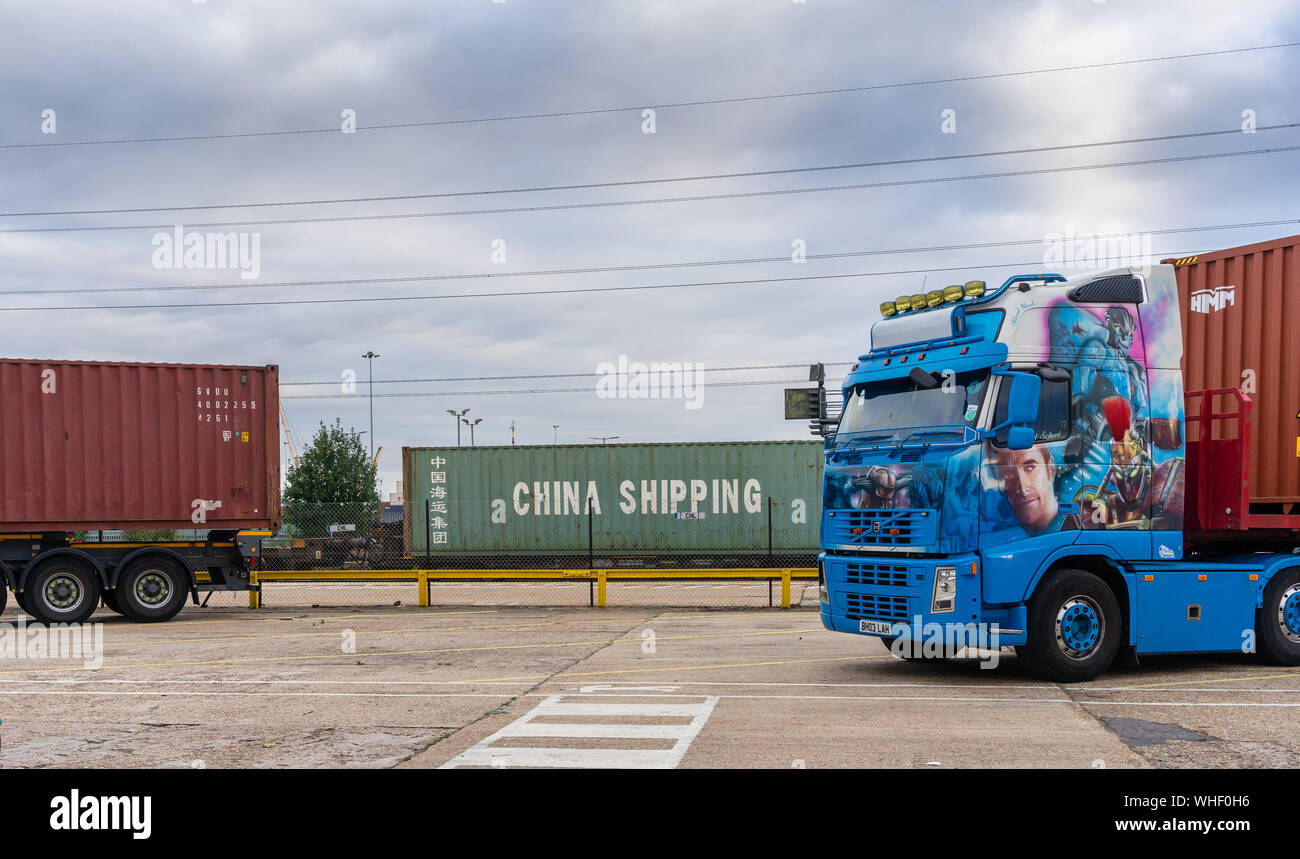 Colourful lorry parked at the Port of Southampton with a China Shipping container in the background at Southampton, England, UK Stock Photo