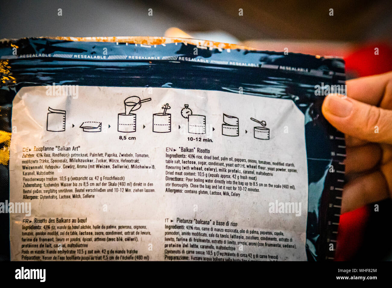 The preparation instructions for the trekking meal "Balkan Art Rice Pan" are printed in several languages on the packaging near Qalai Khumb, Tajikistan. Stock Photo