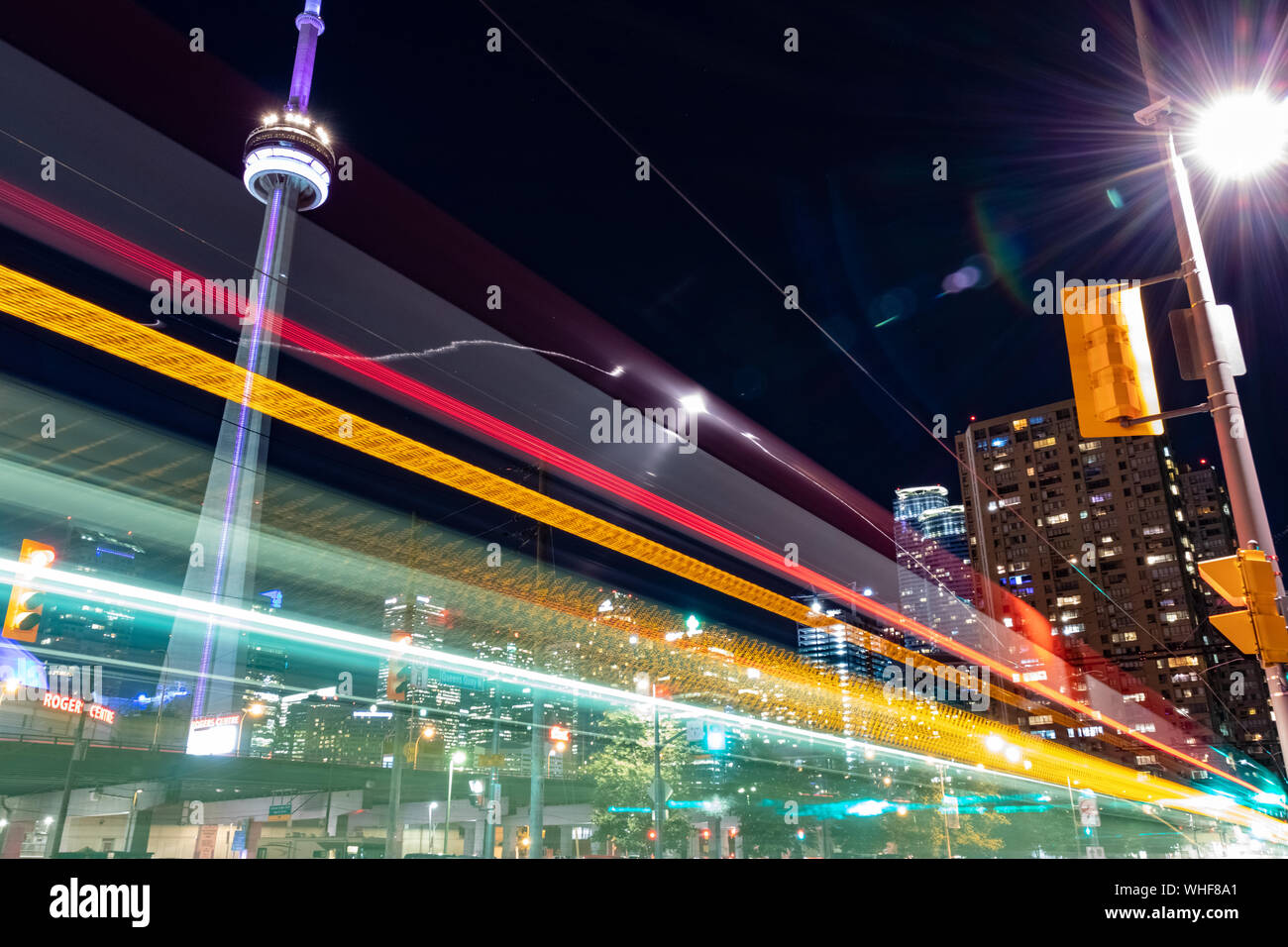 A long exposure of downtown Toronto near the CN tower at night with streetcar light trails. Stock Photo