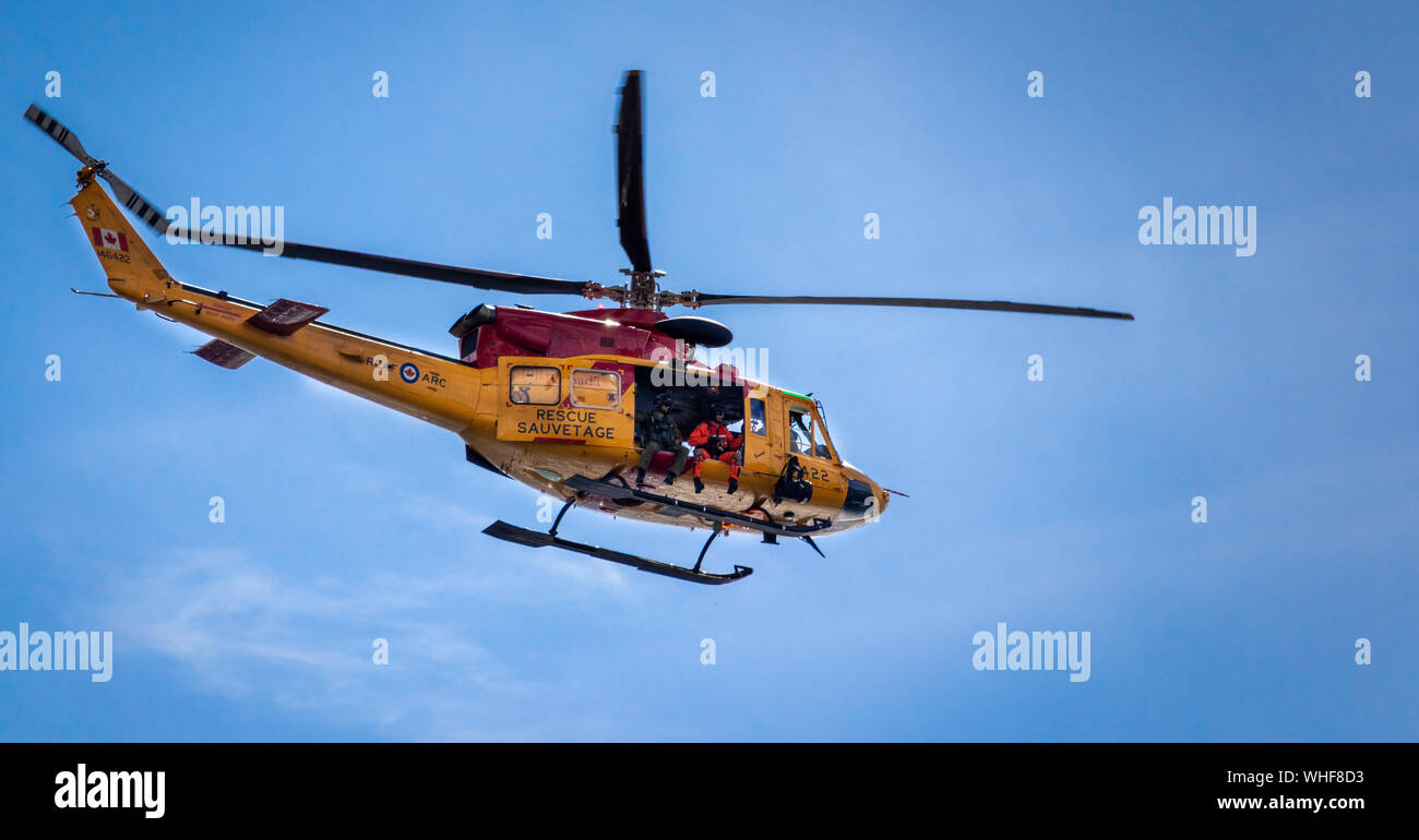 Royal Canadian Air Force search and rescue helicopter patroling the Canadian National Exhibition air show. Stock Photo