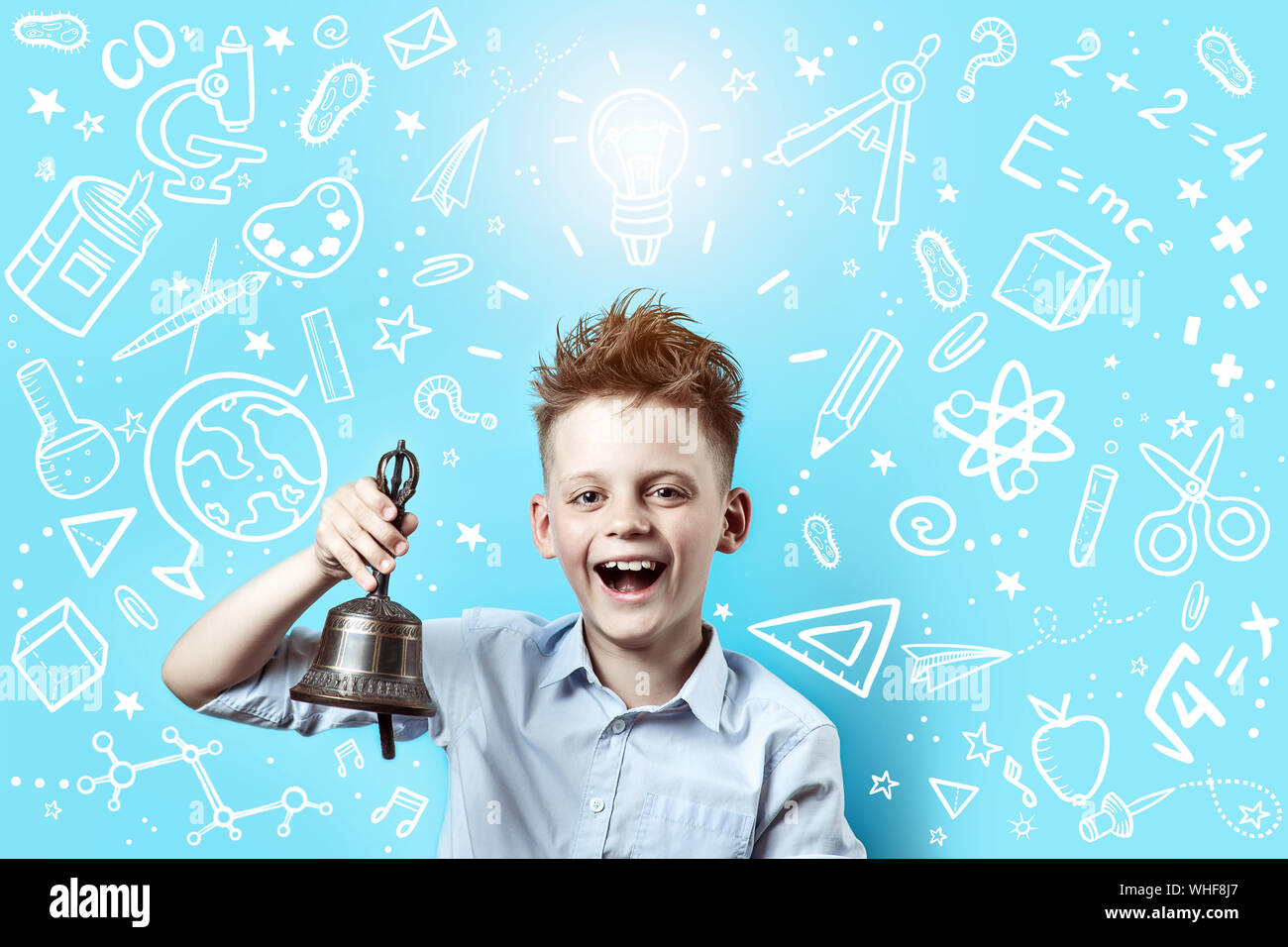 a boy in a light shirt smiles and rings a bell. Around it are various ...