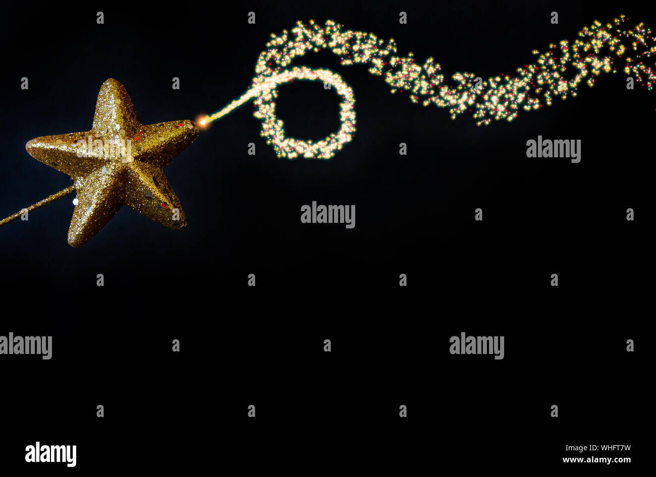 Golden star magiс wand isolated on black background Stock Photo