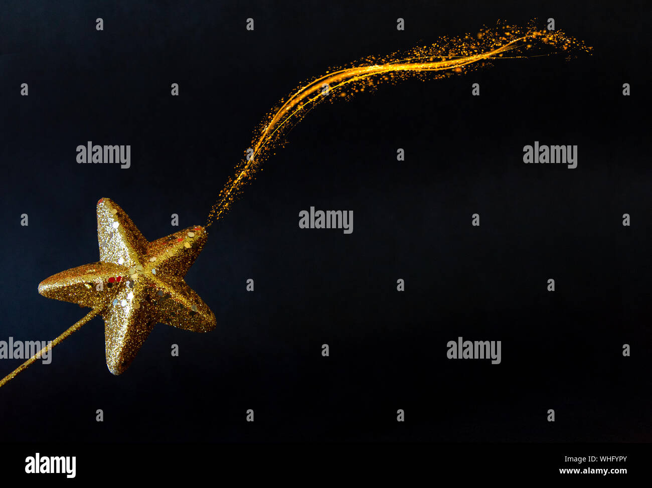 Golden star magiс wand isolated on black background  Stock Photo