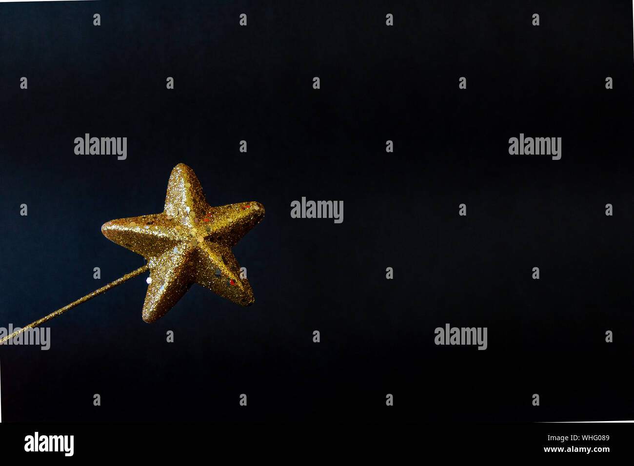 Golden star magiс wand isolated on black background Stock Photo