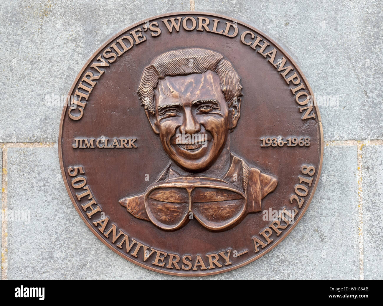 Bronze plaque in memory of Formula One motor racing World Champion Jim Clark in the Berwickshire village of Chirnside. Stock Photo