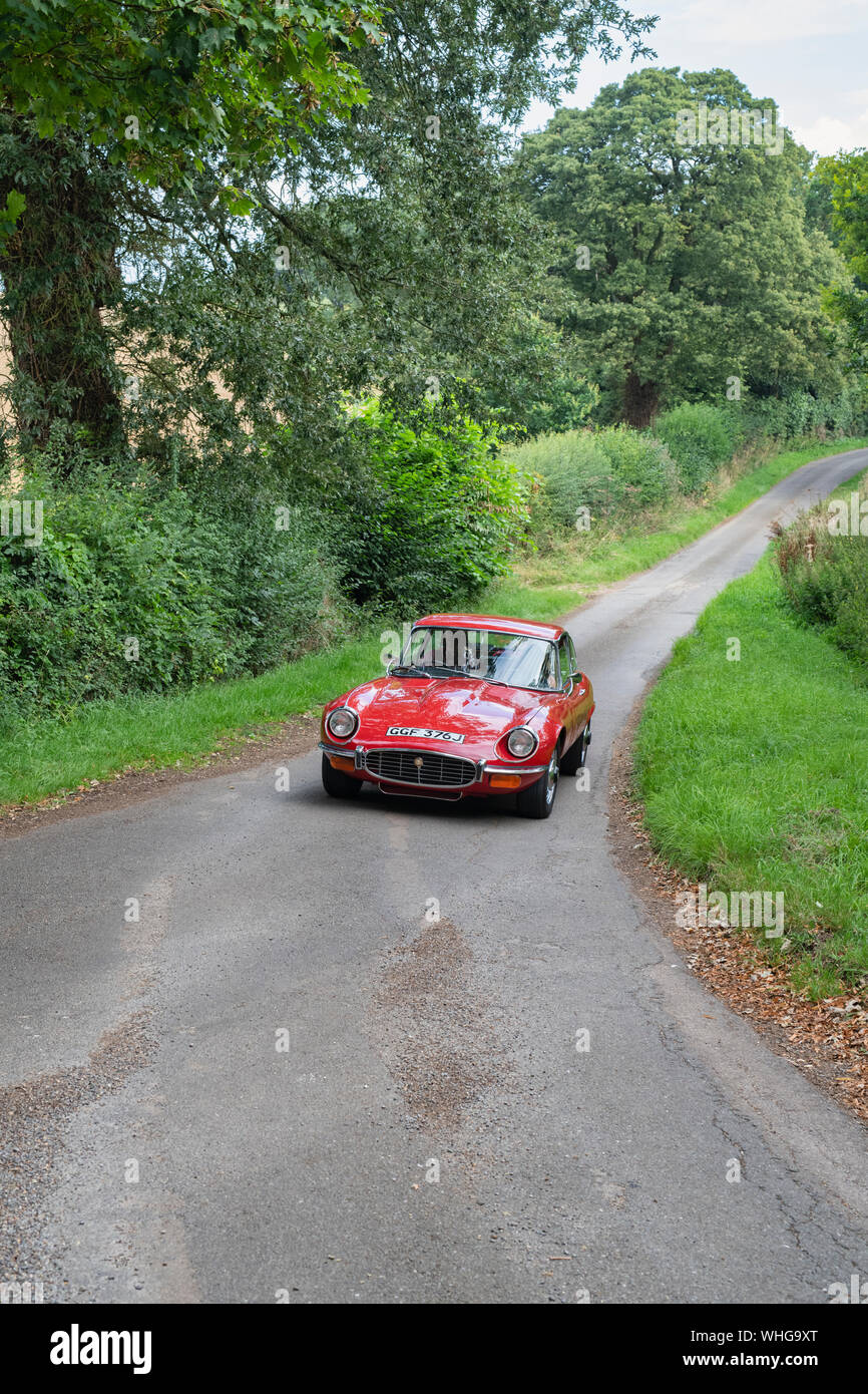 1971 Jaguar E Type going to a classic car show in the Oxfordshire countryside. Broughton, Banbury, England. Stock Photo