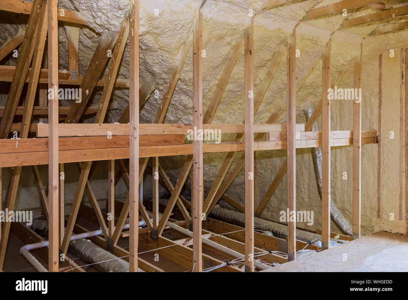 thermal and hidro insulation Inside wall insulation in wooden house, building under construction Stock Photo