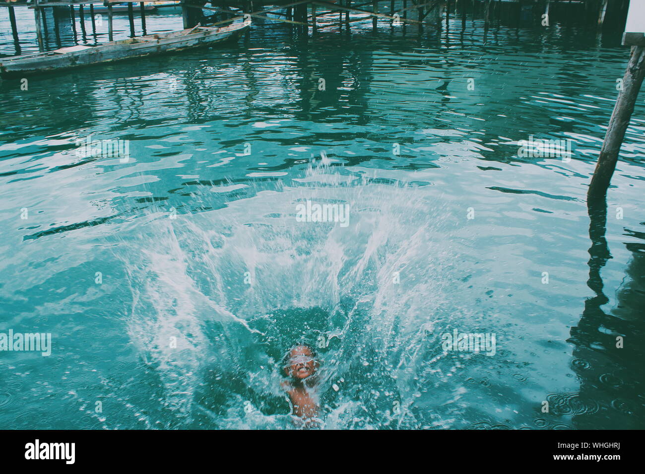 Boy diving in water hi-res stock photography and images - Alamy