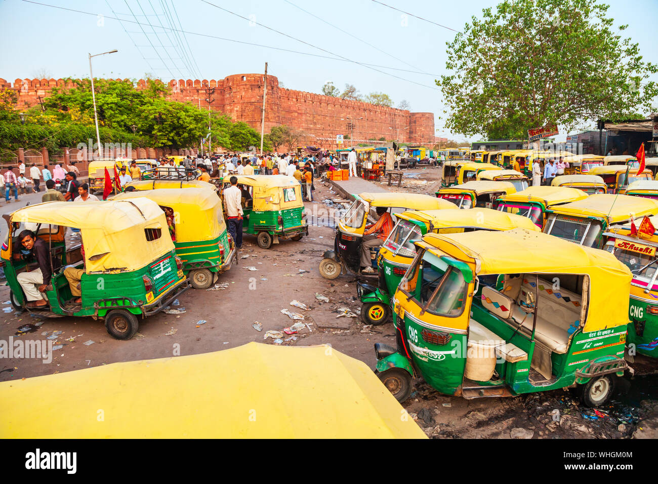 AGRA, INDIA - APRIL 10, 2012: A lot of rickshaws on the street in Agra city, Uttar Pradesh state of India Stock Photo