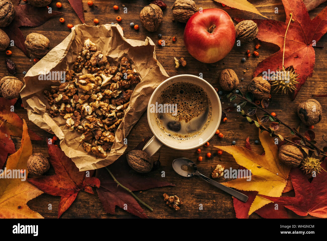 Enjoying fruits of autumn - apple, coffee and walnut on table for Thanksgiving day concept top view Stock Photo