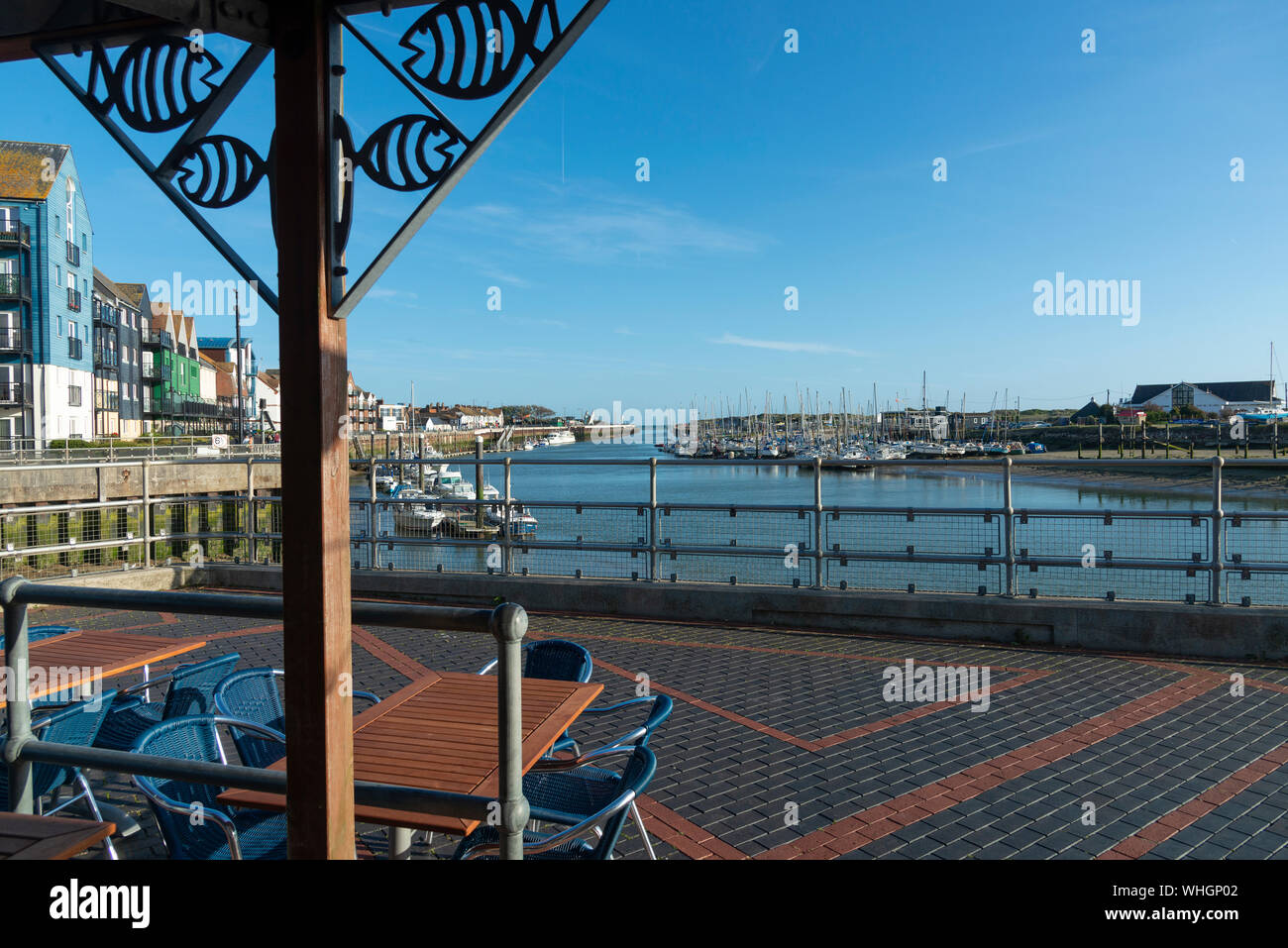 Littlehampton harbour and marina at low tide looking towards the open sea, West Sussex, England