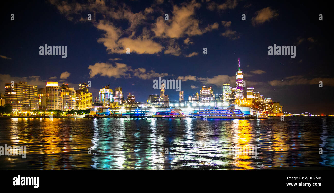 New York City skyline at night looking towards downtown Manhattan Stock Photo