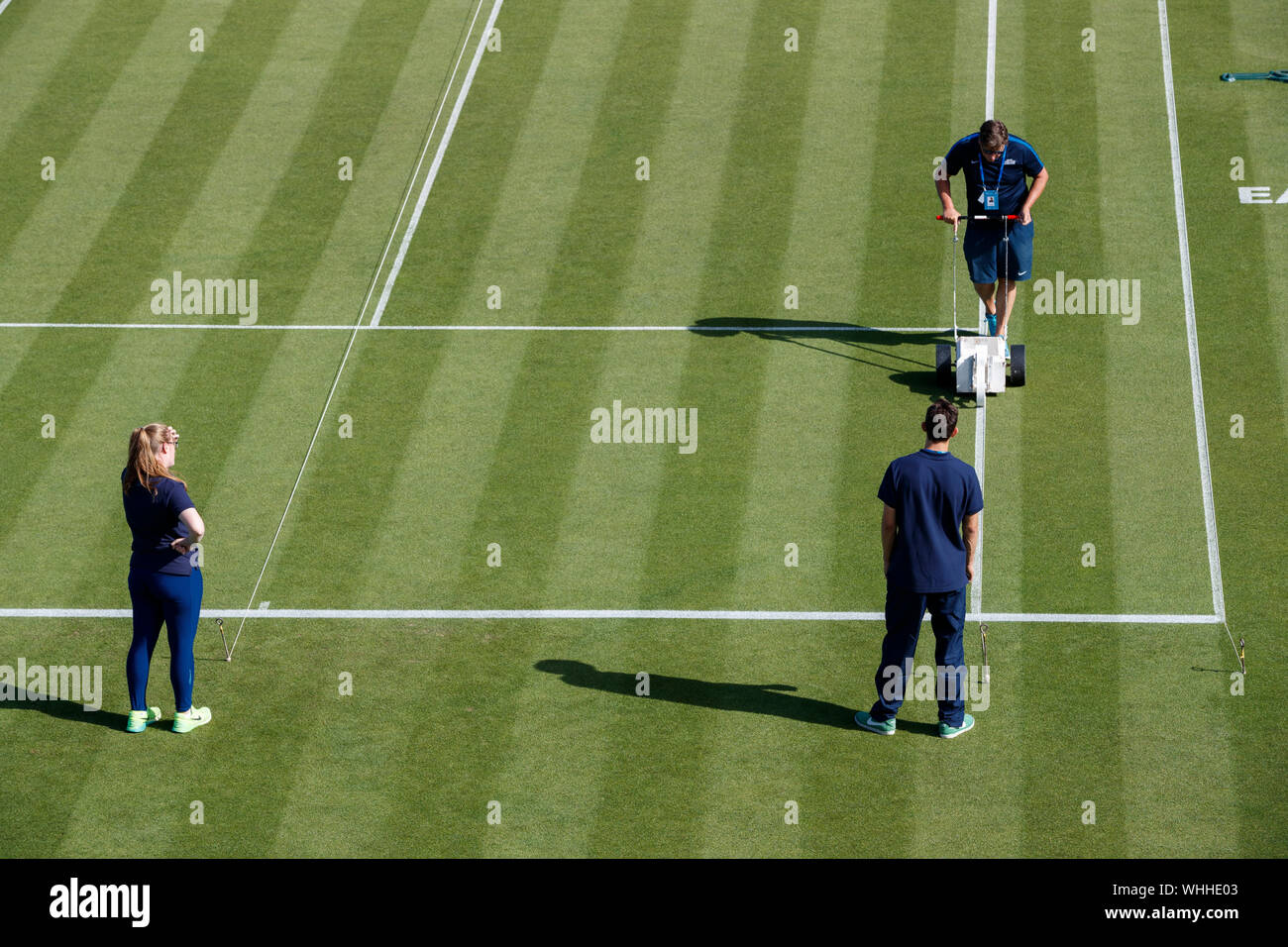 Ground-staff marking tennis court lines at Aegon International 2017- Eastbourne - England. Monday, 26, June.  Photo Credit: Nick Walker/Sport Picture Stock Photo