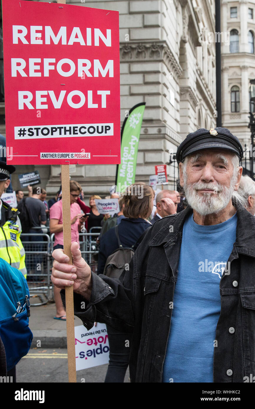 London, UK. 2 September, 2019. Folk singer and peace campaigner Jim Radford joins hundreds of people attending a ‘Stop the Coup’ protest in Whitehall as Prime Minister Boris Johnson makes an address to the nation outside 10 Downing Street to the effect that there will be a vote on a general election if MPs vote for a further delay to Brexit. Credit: Mark Kerrison/Alamy Live News Stock Photo