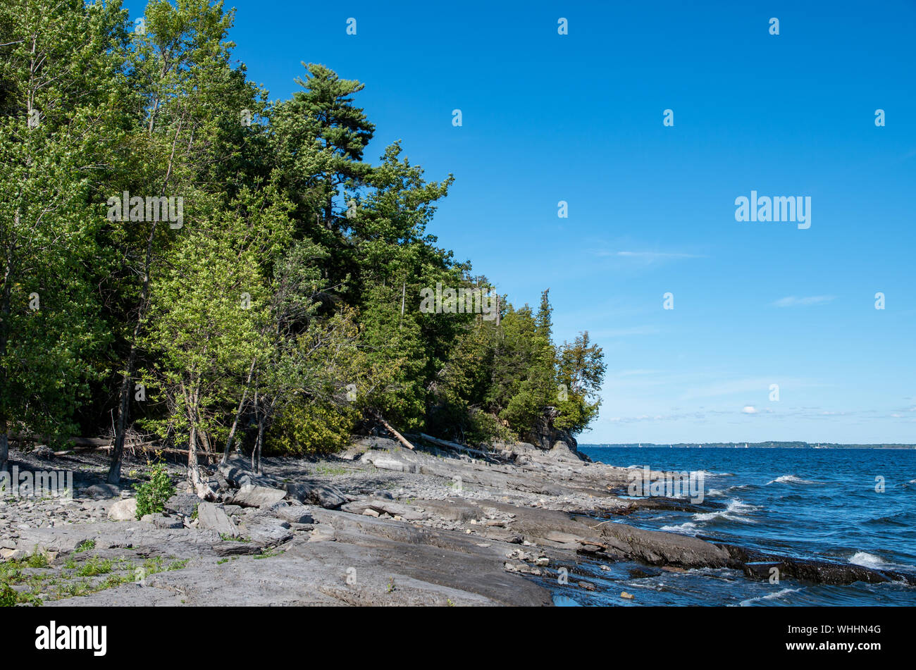 rocky shore along Lake Champlain on a summer day Stock Photo