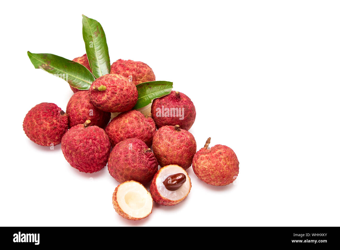 Close-up Of Litchi Against White Background Stock Photo