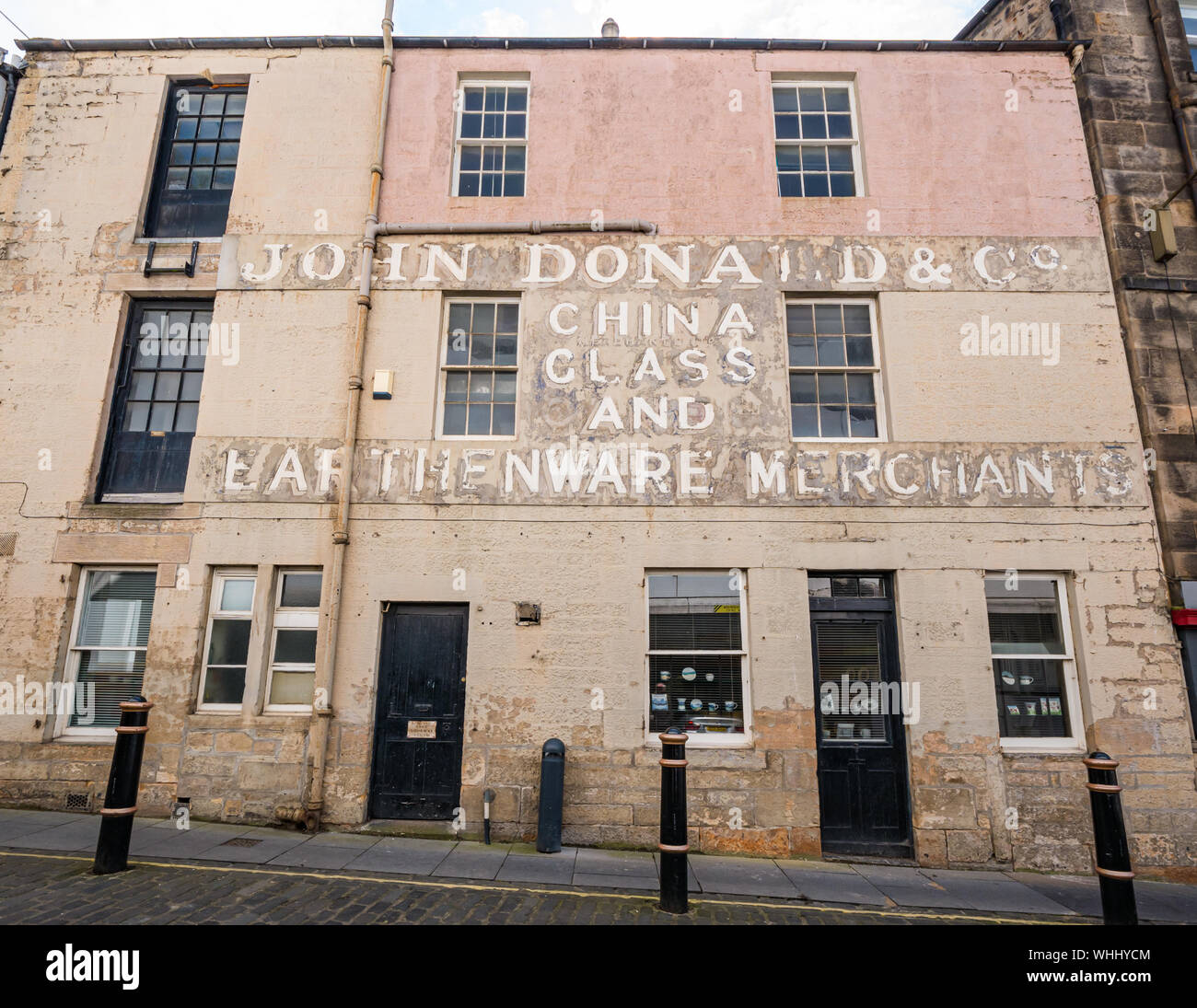 Ghost lettering of old shop sign, John Donald earthenware and ceramics shop, Edinburgh, Scotland, UK Stock Photo