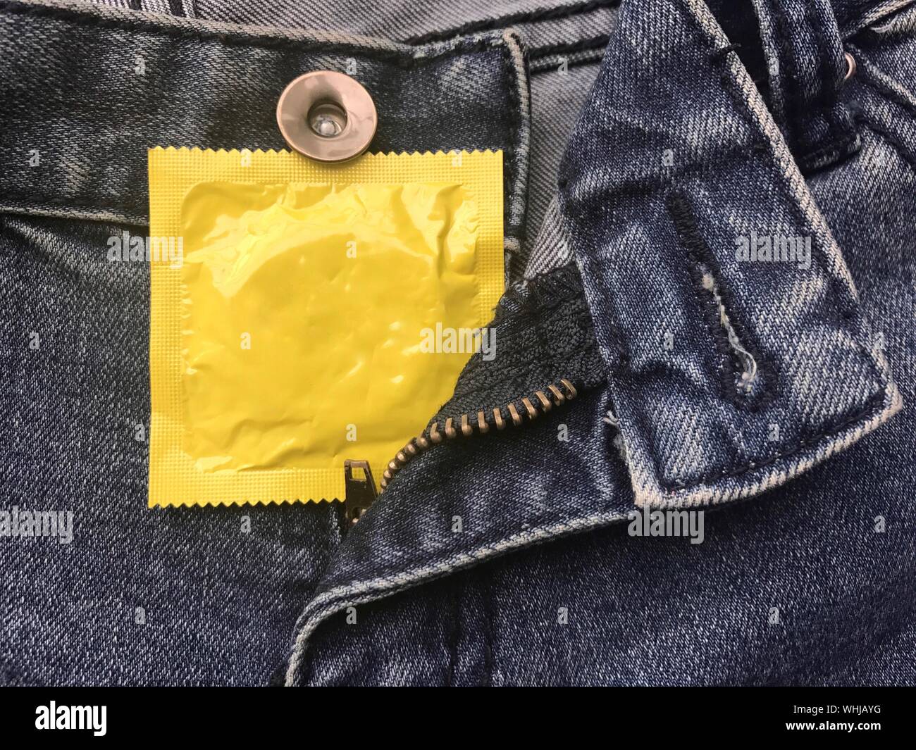 Download Close Up Of Yellow Condom Packet In Jeans Pocket Stock Photo Alamy Yellowimages Mockups