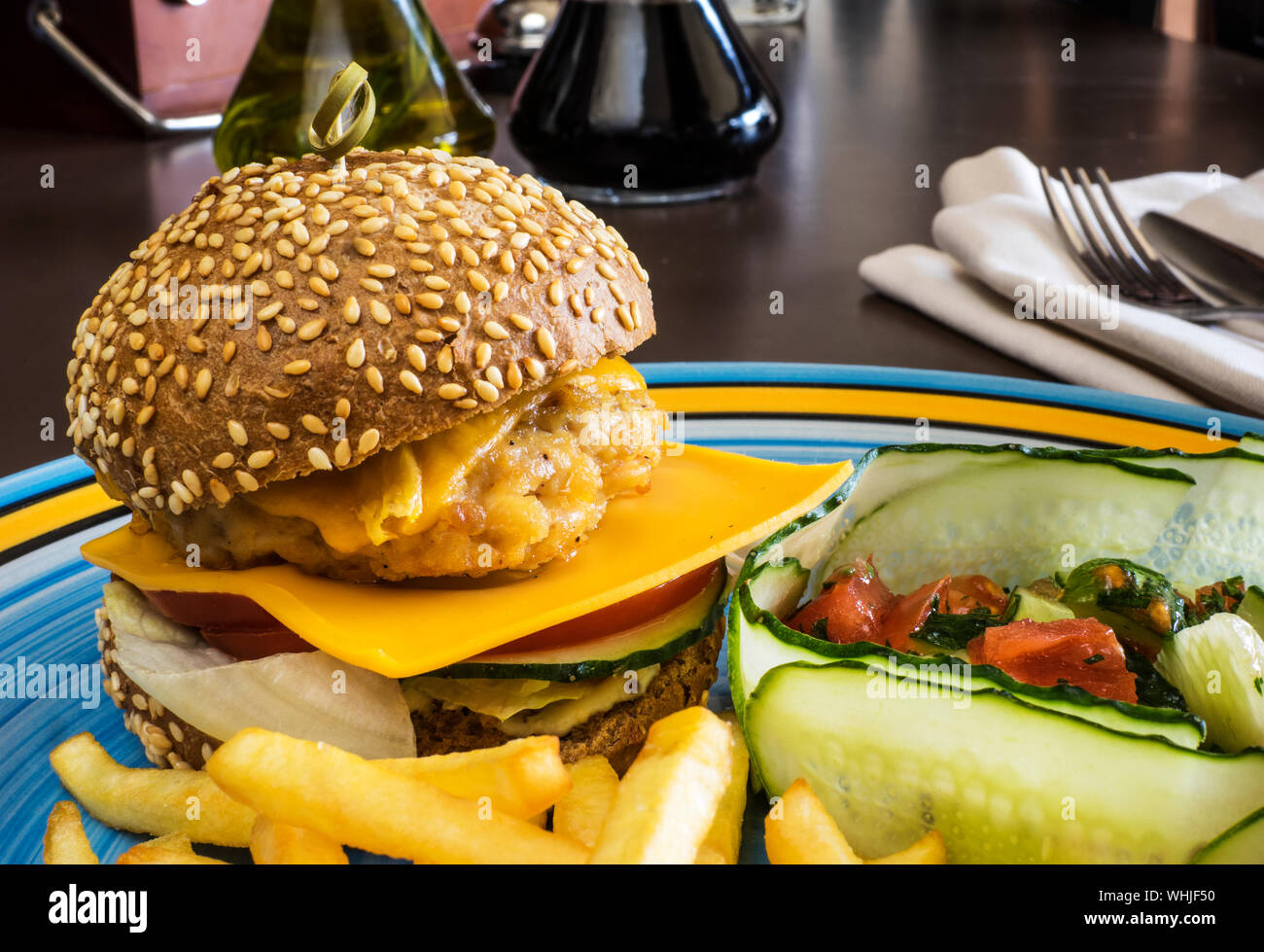 Close-up Of Cheeseburger With French Fries Served In Plate Stock Photo