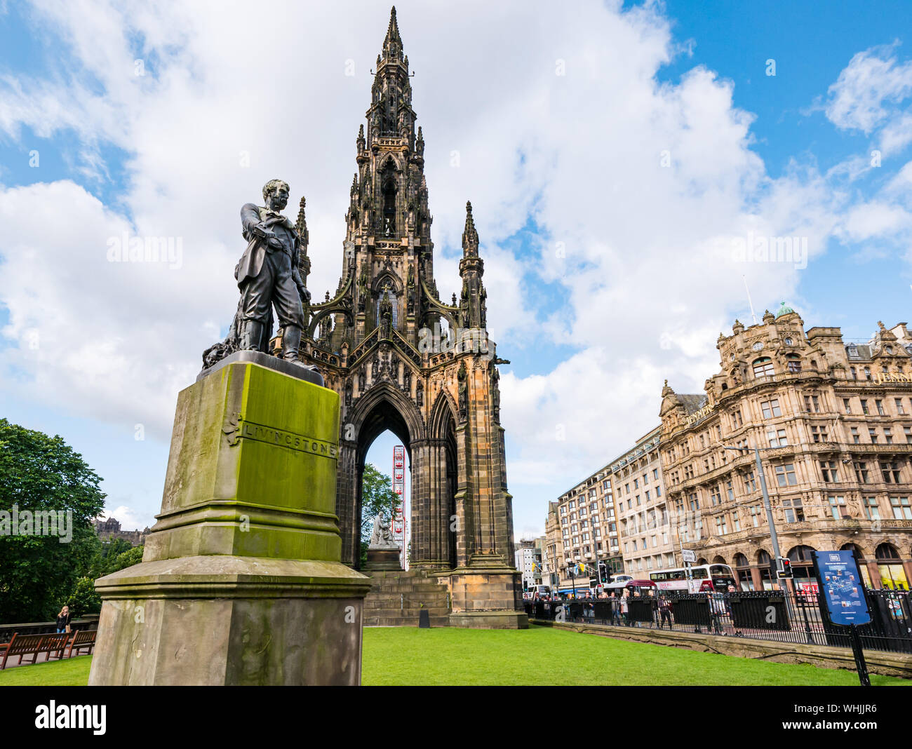 Victorian Gothic Scott monument & David Livingstone statue, Princes Street during festival with M&D Big Whee & Jenner’s store Edinburgh, Scotland, UK Stock Photo