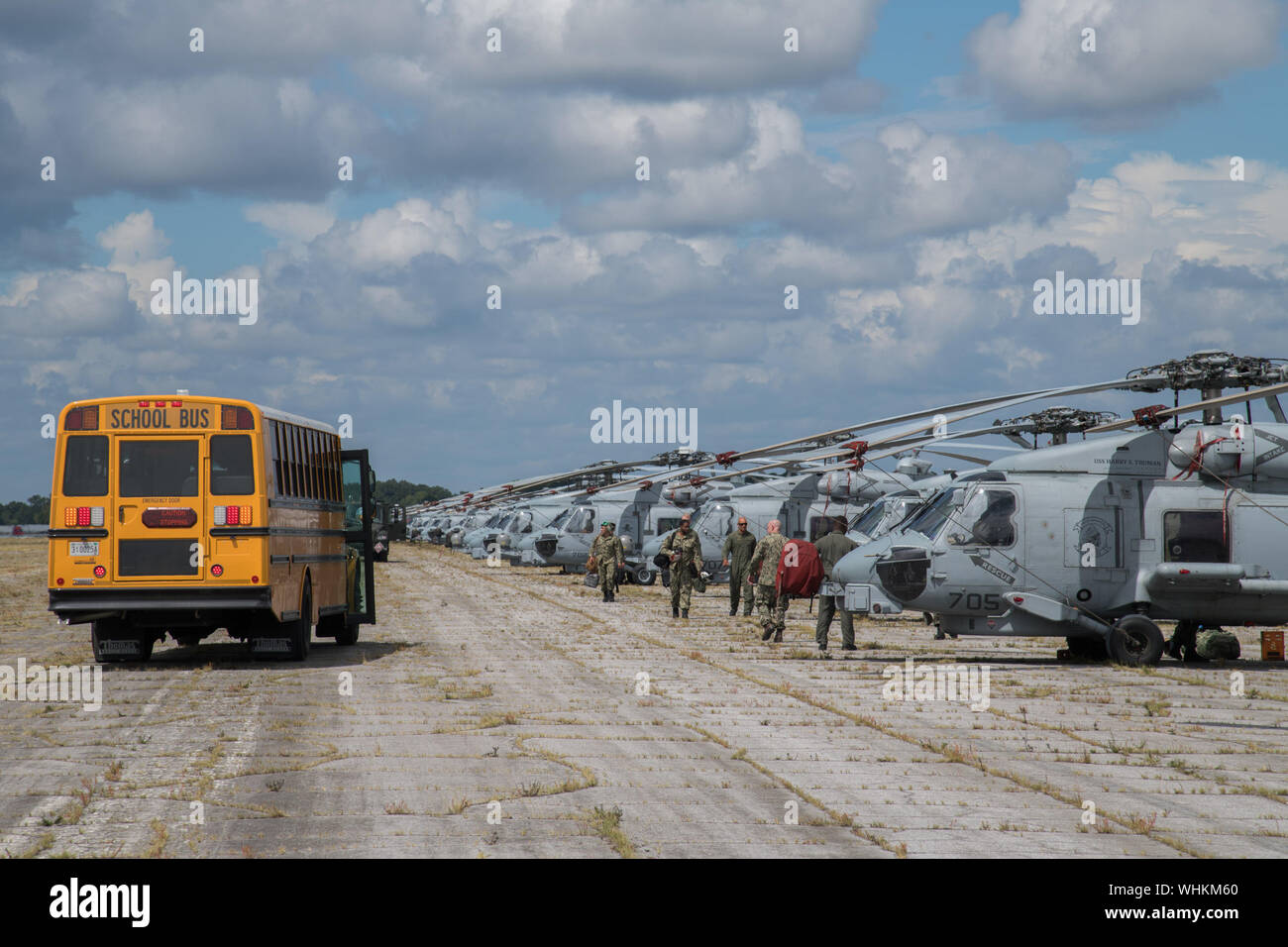 Sailors depart U.S. Navy MH60R Sea Hawk helicopters after arriving at Maxwell Air Force Base