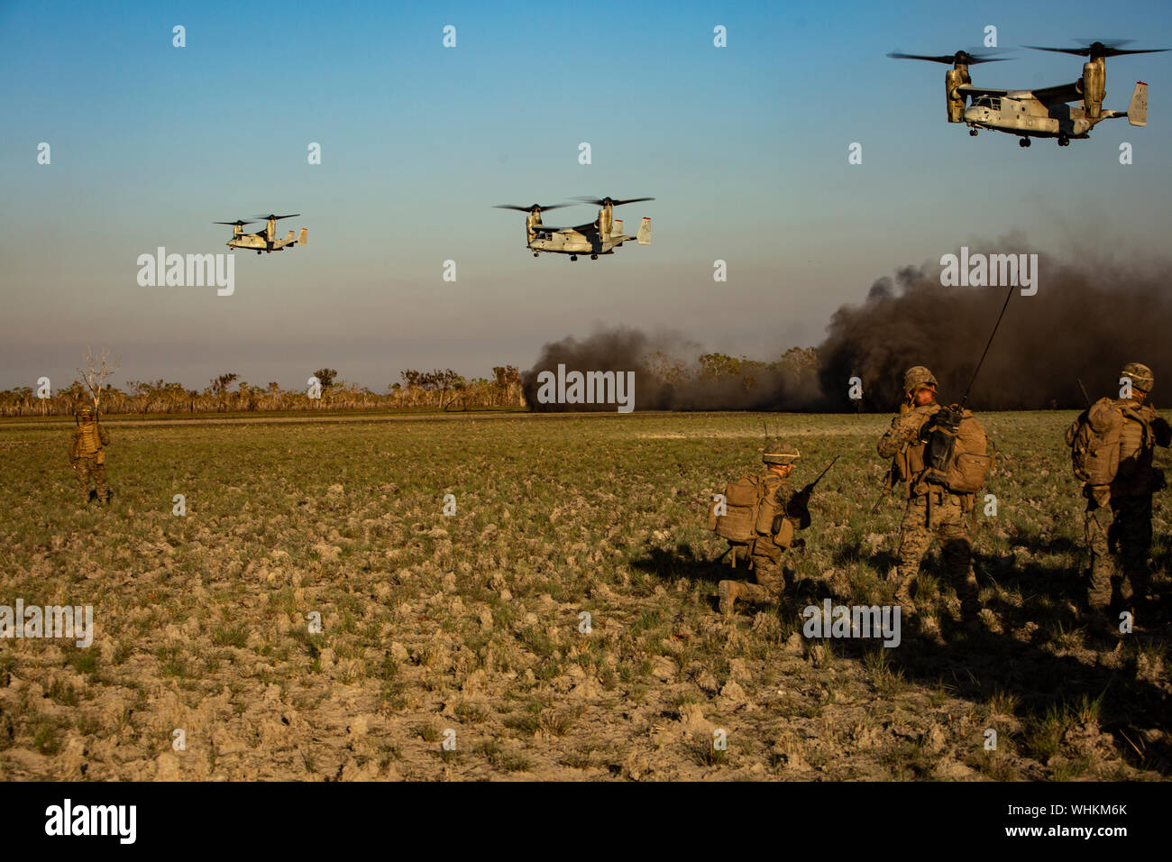 U.S. Marines with the Ground Combat Element, Marine Rotational Force - Darwin, await to be inserted via MV-22 Ospreys during a company raid in Exercise Koolendong at Mount Bundey Training Area, NT, Australia, Aug. 23, 2019. Koolendong is a live-fire bilateral exercise conducted to increase interoperability between U.S. Marines and the Australian Defence Force. (U.S. Marine Corps photo by Lance Cpl. Nicholas Filca) Stock Photo