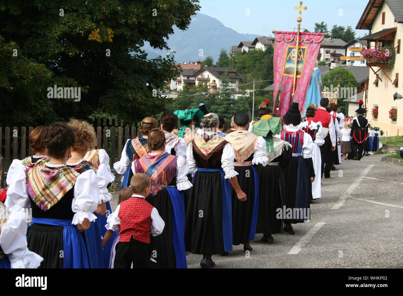 Rear View Of People Walking On Road During Traditional Event Stock Photo