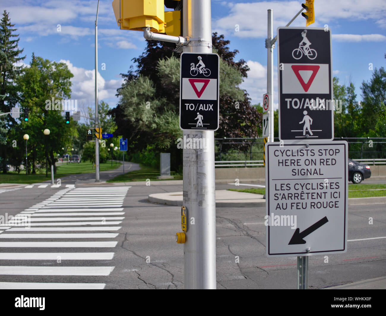 Trillium pathway bicycle path crosswalk signs at the busy Carling