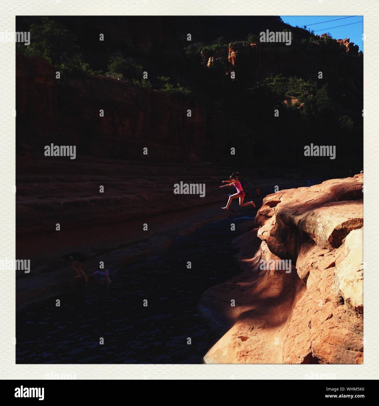 Girl jumping in river hi-res stock photography and images - Alamy