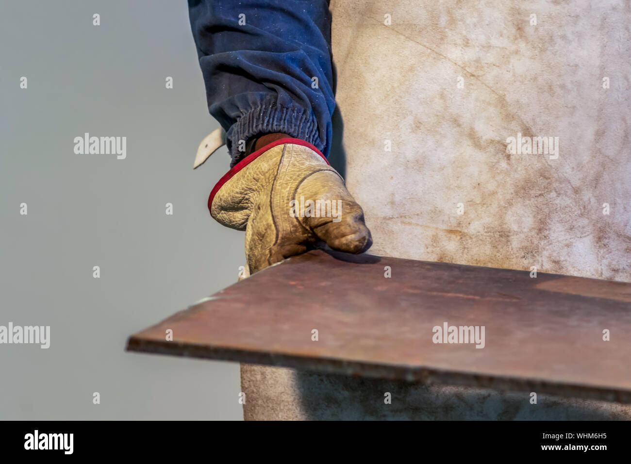 Motswana worker operating a Rolling Machine in a Botswana workshop Stock Photo