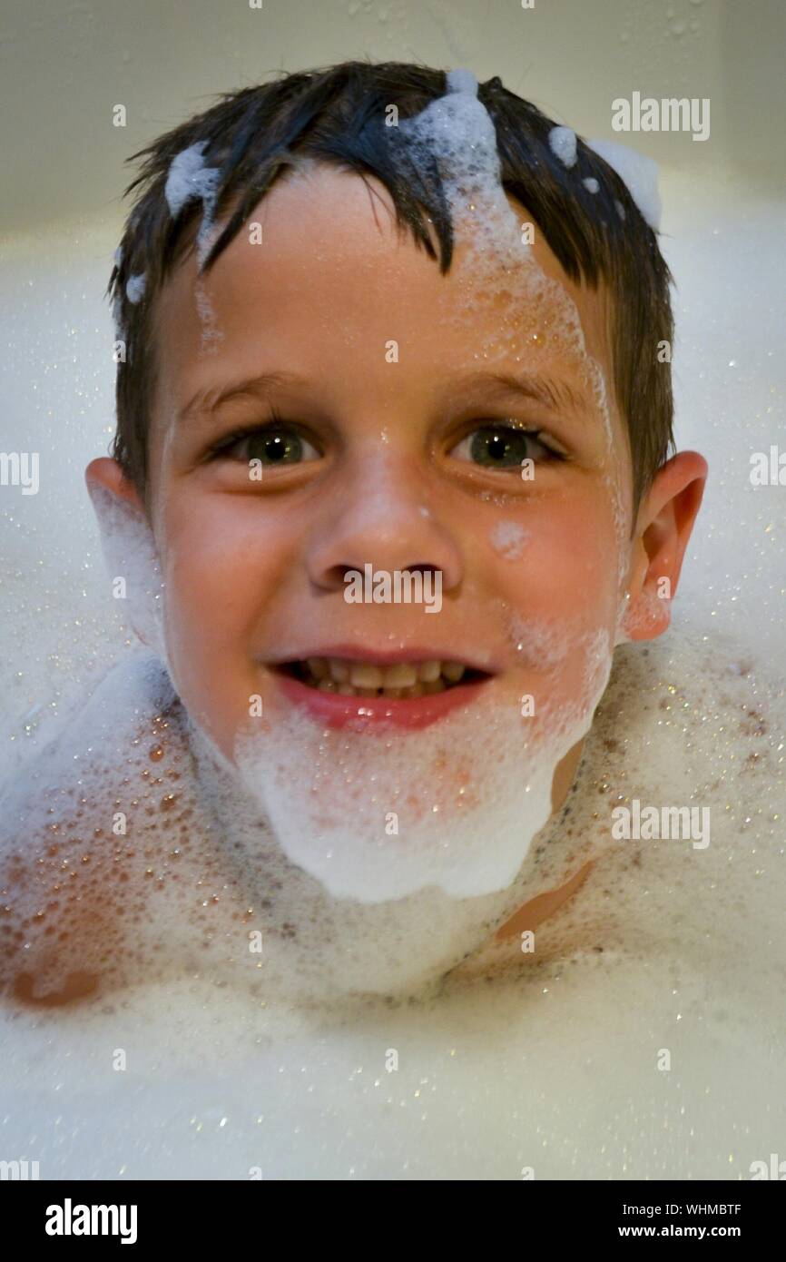 Boy taking bubble bath hires stock photography and images Alamy