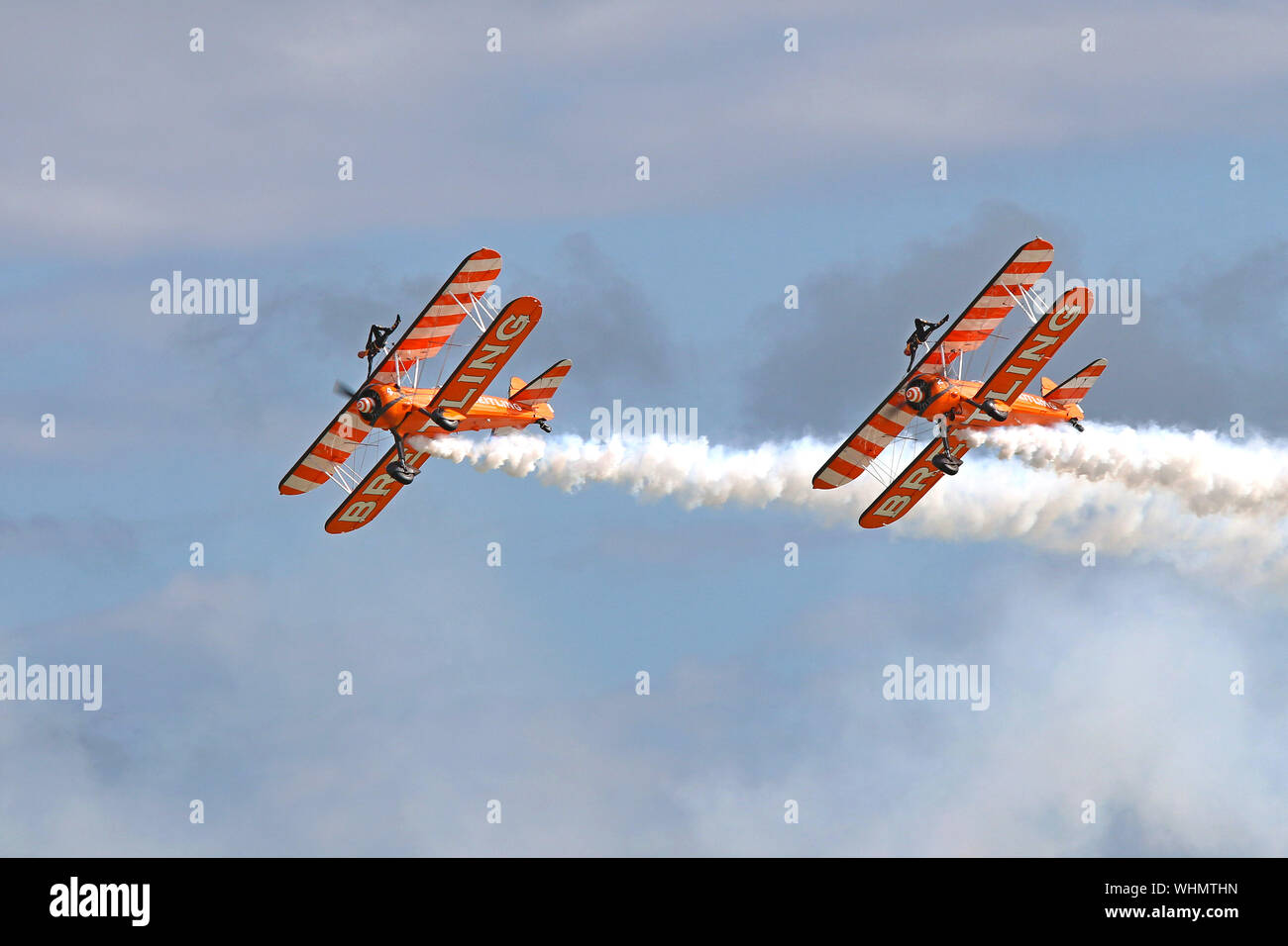 The Breitling Wingwalkers with their 1940's biplanes and the young ladies strapped on top wows the crowd at Eastbourne's International Airshow, 2017. Stock Photo