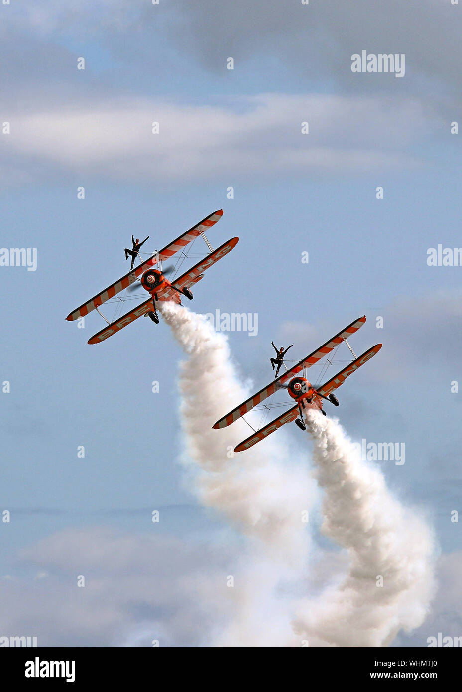The Breitling Wingwalkers with their 1940's biplanes and the young ladies strapped on top wows the crowd at Eastbourne's International Airshow, 2017. Stock Photo