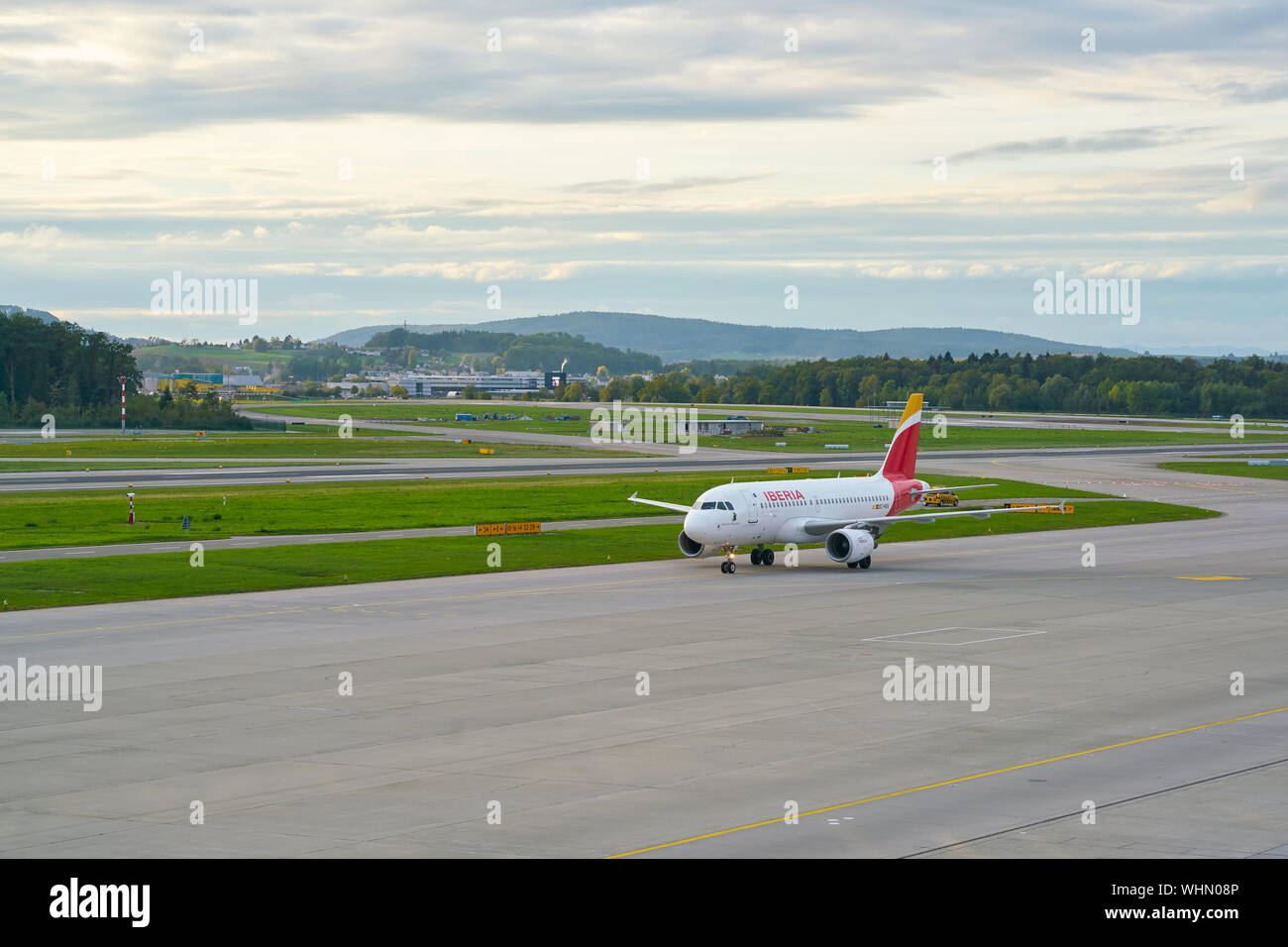 ZURICH, SWITZERLAND - CIRCA OCTOBER, 2018:  an Iberia aircraft taxing at Zurich International Airport. Stock Photo