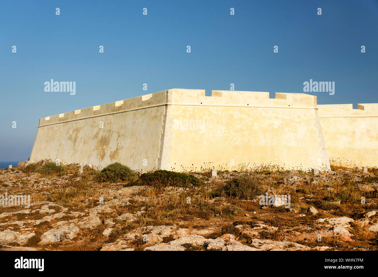 Surrounding Wall Against Clear Blue Sky Stock Photo
